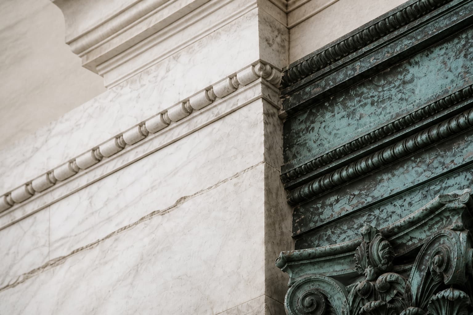Pentelic marble and weathered verdigris bronze architectural detail