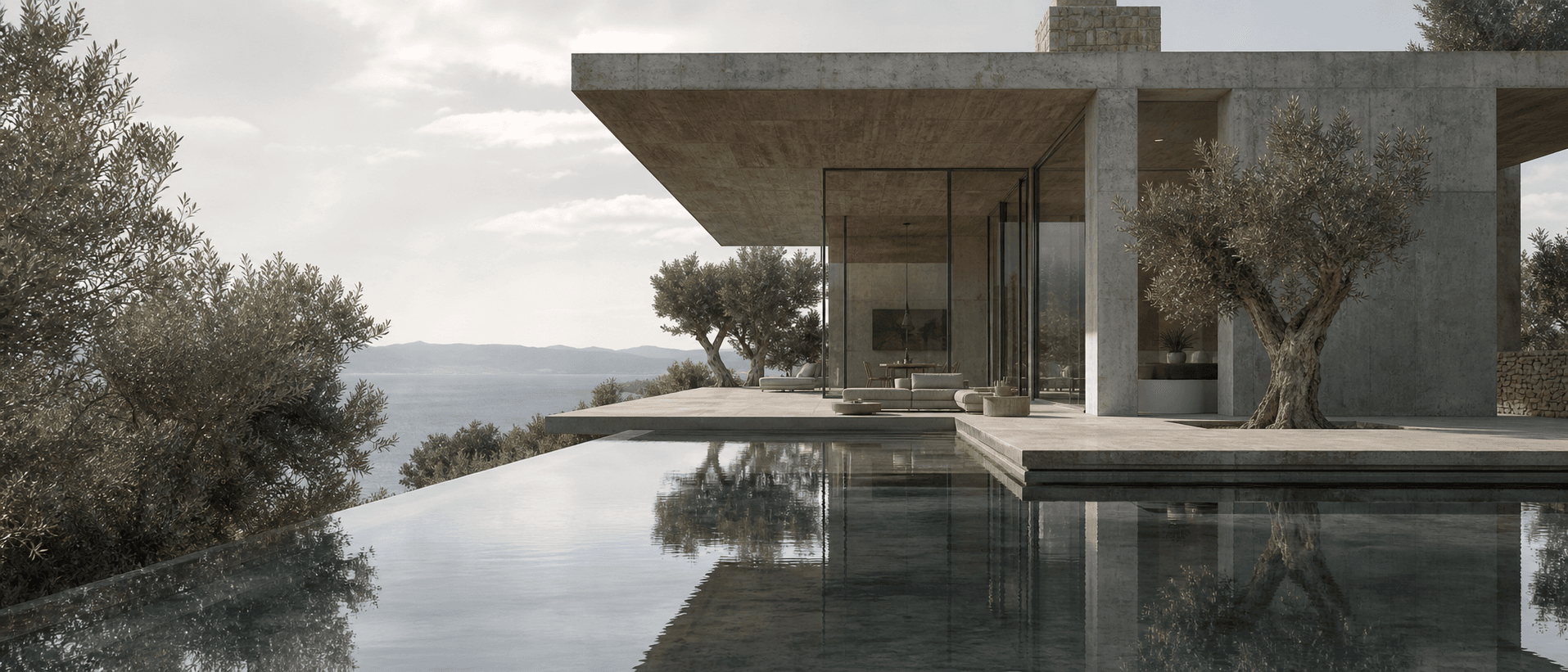 A contemporary Greek villa with olive trees and an infinity pool